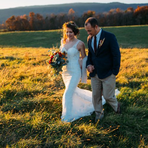 Couple walking in pasture